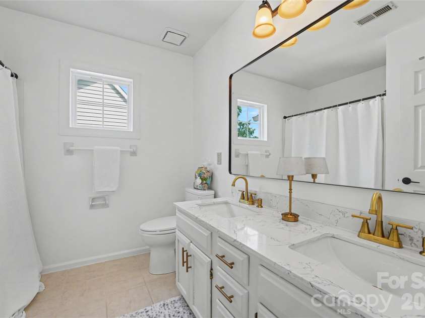 17205 Asti Court, Cornelius, NC 28031.  MLS# CAR4406087, YatesRealty ID 43276. Hall Bathroom with double sinks.