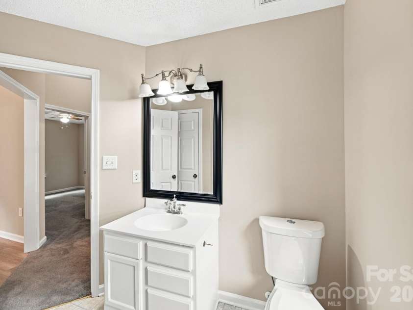 7632 Free Bird Avenue, Charlotte, NC 28216.  MLS# CAR4411446, YatesRealty ID 43281. Bright secondary bathroom