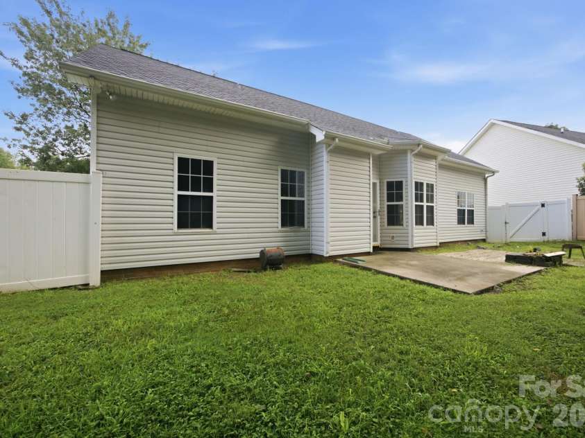 7632 Free Bird Avenue, Charlotte, NC 28216.  MLS# CAR4411446, YatesRealty ID 43281. Fence provides some privacy