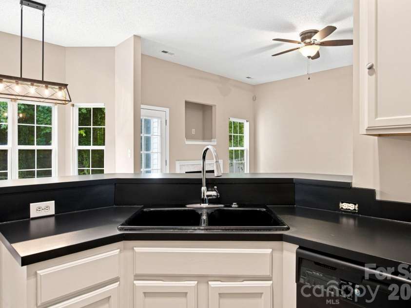 7632 Free Bird Avenue, Charlotte, NC 28216.  MLS# CAR4411446, YatesRealty ID 43281. Kitchen overlooking sunny dining and great room- terrific for entertaining