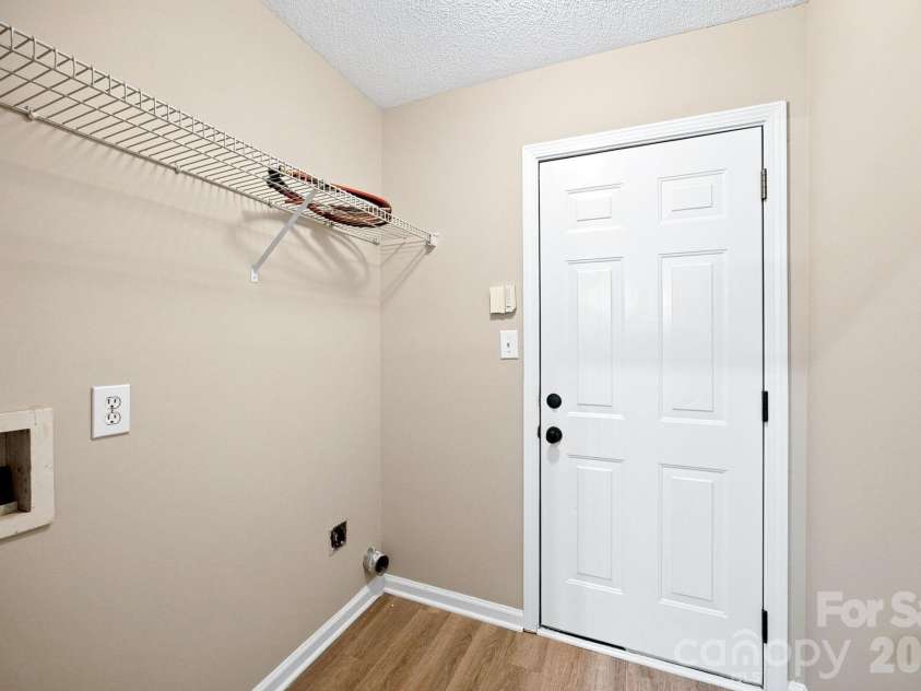 7632 Free Bird Avenue, Charlotte, NC 28216.  MLS# CAR4411446, YatesRealty ID 43281. Laundry/mudroom is convenient located between the garage and kitchen. Create a drop zone to keep things tidy