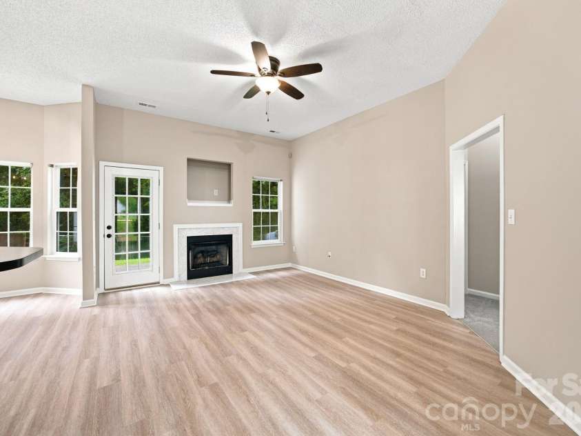 7632 Free Bird Avenue, Charlotte, NC 28216.  MLS# CAR4411446, YatesRealty ID 43281. Open floor plan is bright, spacious, and move-in ready- complete with fireplace and ceiling fan