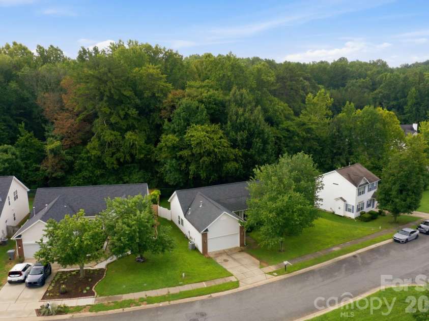 7632 Free Bird Avenue, Charlotte, NC 28216.  MLS# CAR4411446, YatesRealty ID 43281. Setting is private- located on a double cul-de-sac.  Sidewalks are great for walking or rolling down the street