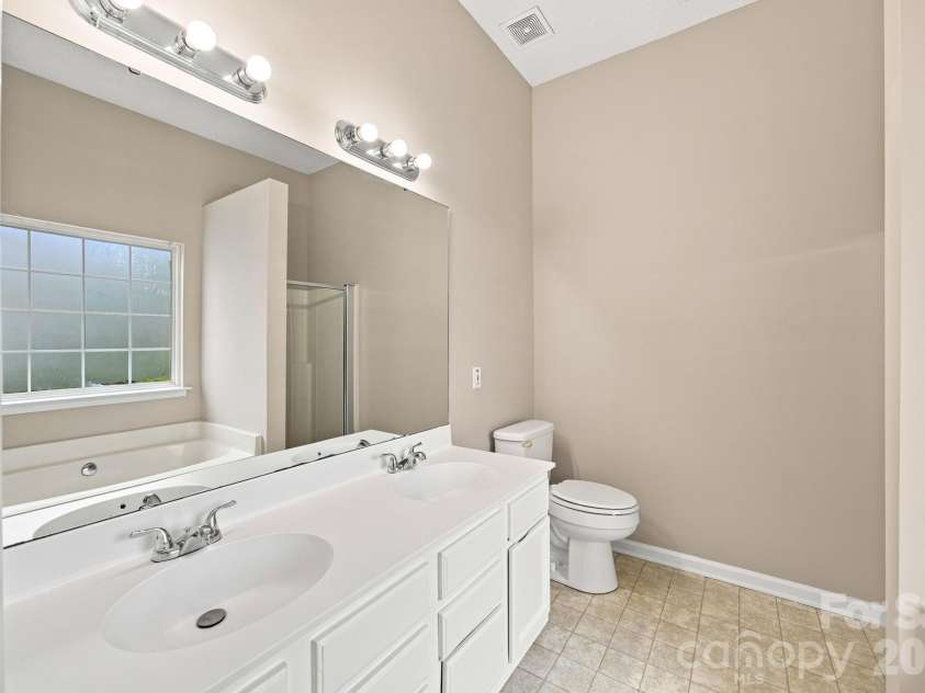 7632 Free Bird Avenue, Charlotte, NC 28216.  MLS# CAR4411446, YatesRealty ID 43281. White cabinets- look so nice
