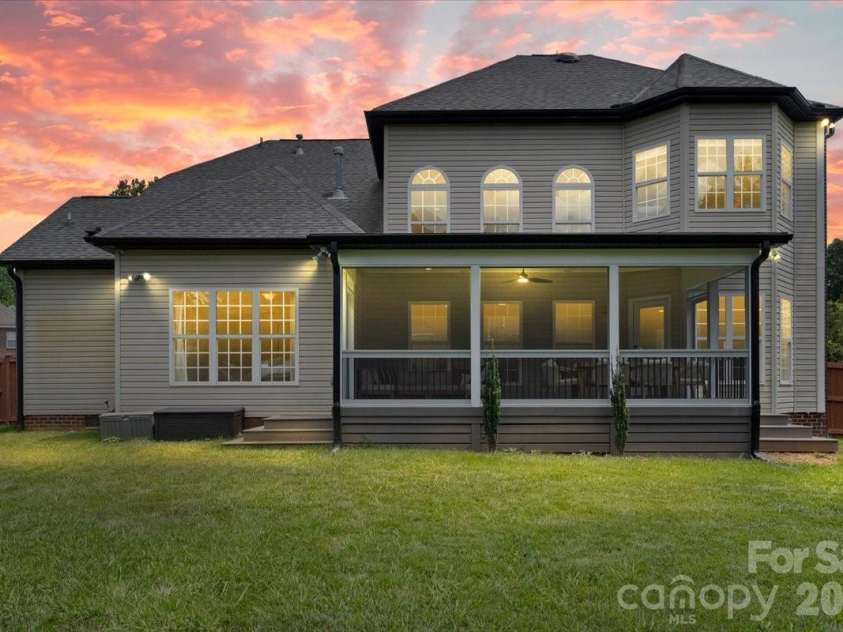 2519 Fallbrook Place, Concord, NC 28027.  MLS# CAR4319310, YatesRealty ID 43283. Back Exterior at Dusk. *Photo has been virtually enhanced.*