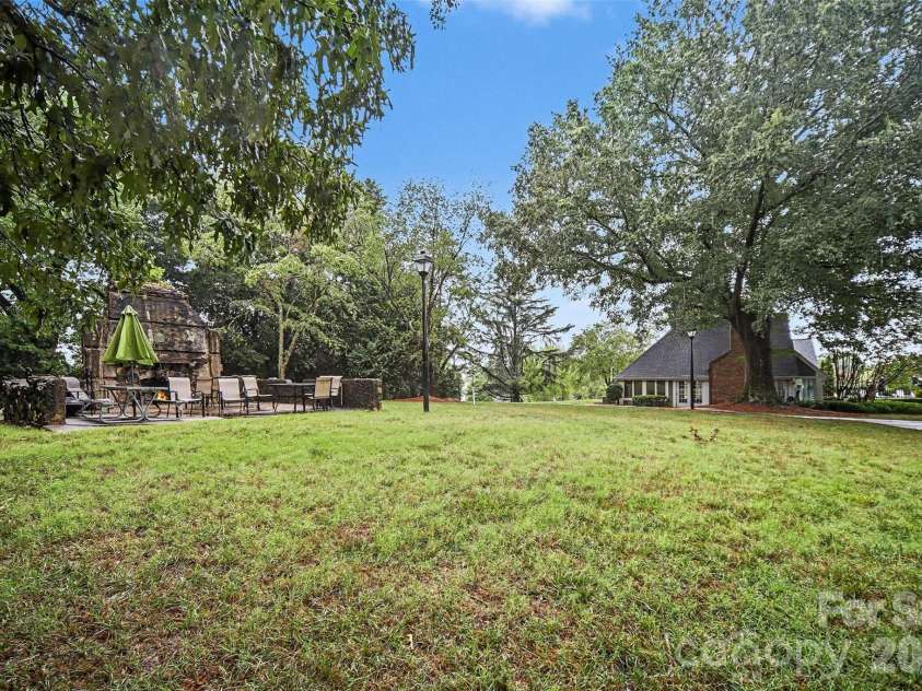 8205 Tradd Court, Charlotte, NC 28210.  MLS# CAR4408479, YatesRealty ID 43294. Green space lined with sidewalk paths