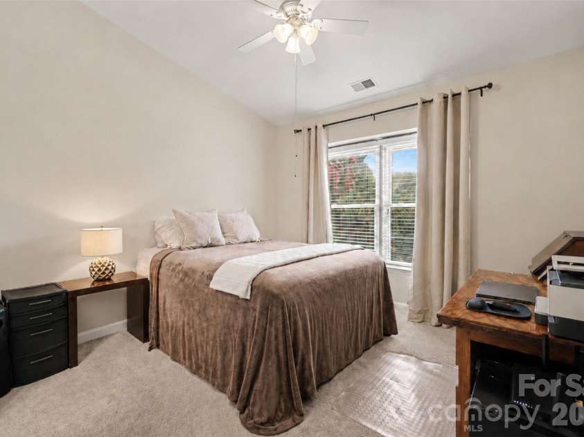 8205 Tradd Court, Charlotte, NC 28210.  MLS# CAR4408479, YatesRealty ID 43294. Second bedroom with vaulted ceiling