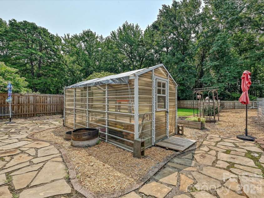 8812 Crestwood Drive, Mount Pleasant, NC 28124.  MLS# CAR4408679, YatesRealty ID 43303. Greenhouse built 2022