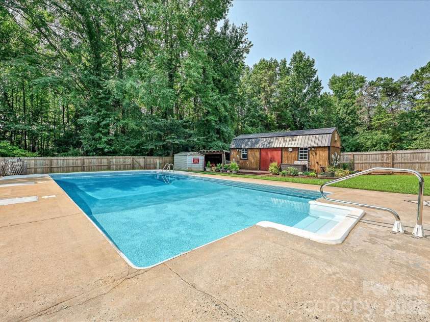 8812 Crestwood Drive, Mount Pleasant, NC 28124.  MLS# CAR4408679, YatesRealty ID 43303. Inground saltwater pool