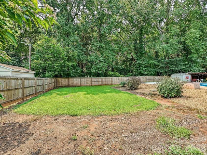 8812 Crestwood Drive, Mount Pleasant, NC 28124.  MLS# CAR4408679, YatesRealty ID 43303. Level lot with privacy fence