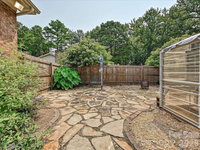 8812 Crestwood Drive, Mount Pleasant, NC 28124.  MLS# CAR4408679, YatesRealty ID 43303. Pathways to greenhouse