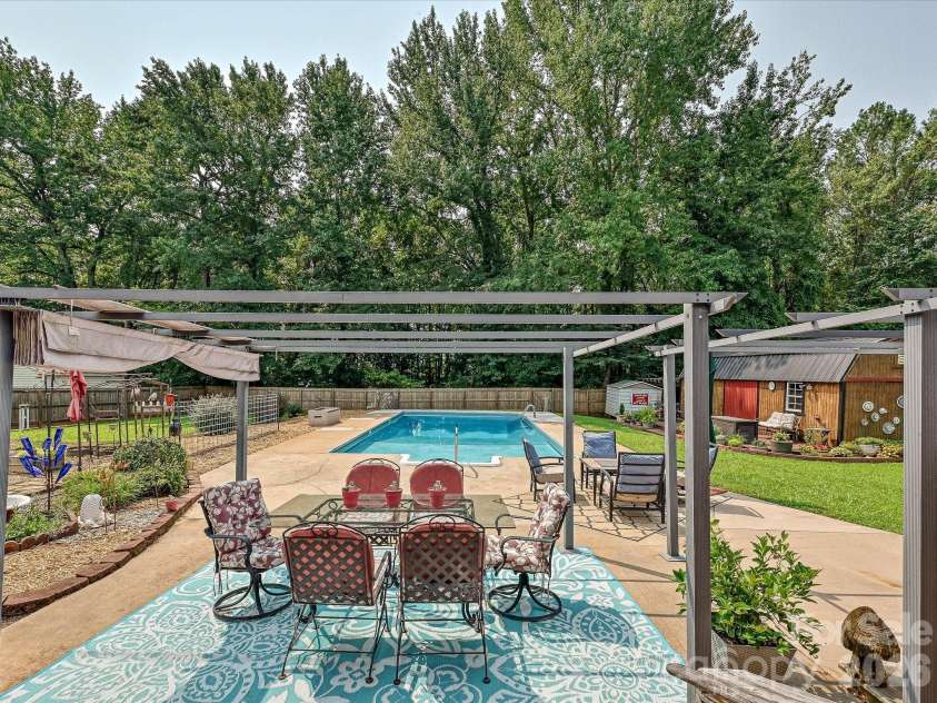 8812 Crestwood Drive, Mount Pleasant, NC 28124.  MLS# CAR4408679, YatesRealty ID 43303. Patio overlooking pool