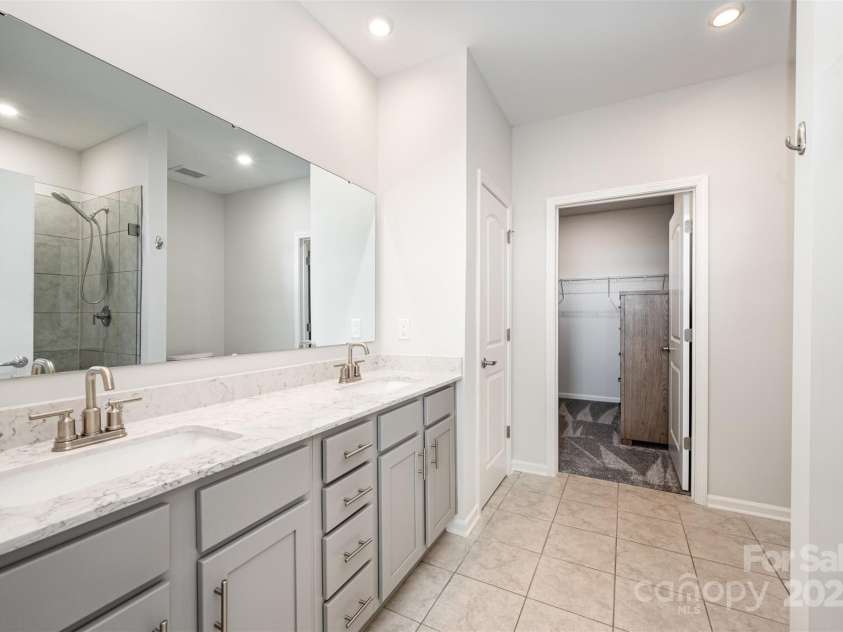 4455 Reed Creek Drive, Sherrills Ford, NC 28673.  MLS# CAR4313344, YatesRealty ID 4331. Large primary bathroom. 