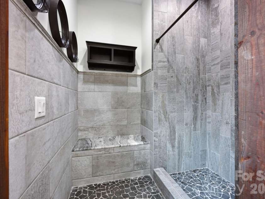 111 Quaker Road, Mooresville, NC 28117.  MLS# CAR4407385, YatesRealty ID 43314. Pool Bath has Built-In Changing Bench