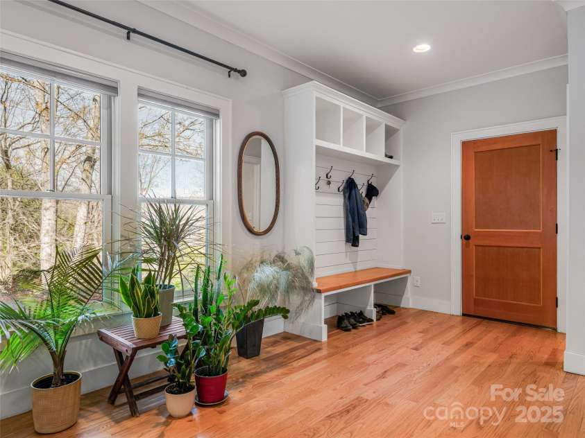 52 Beaverdam Knoll Road, Asheville, NC 28804.  MLS# CAR4242445, YatesRealty ID 4332. West-facing front windows, entryway storage with convenient built-ins, interior entrance to oversized 2-car garage