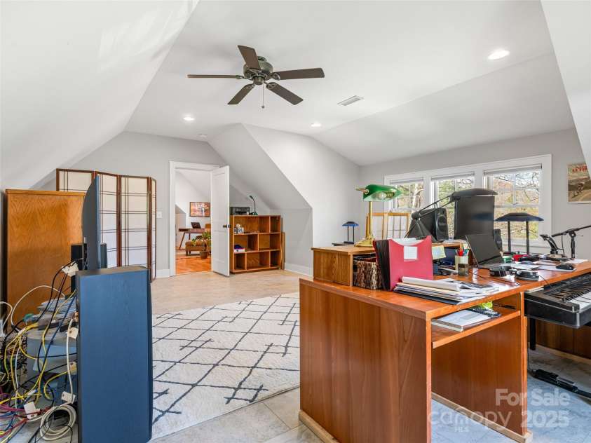 52 Beaverdam Knoll Road, Asheville, NC 28804.  MLS# CAR4242445, YatesRealty ID 4332. West-facing wall of windows in the bonus room