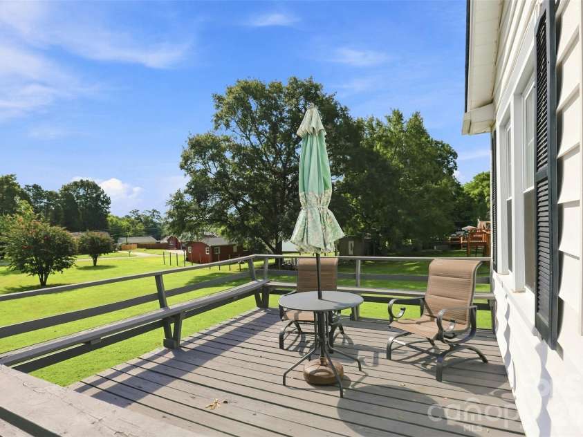 1106 Main Street, Mount Holly, NC 28120.  MLS# CAR4413131, YatesRealty ID 43348. Deck overlooking back yard