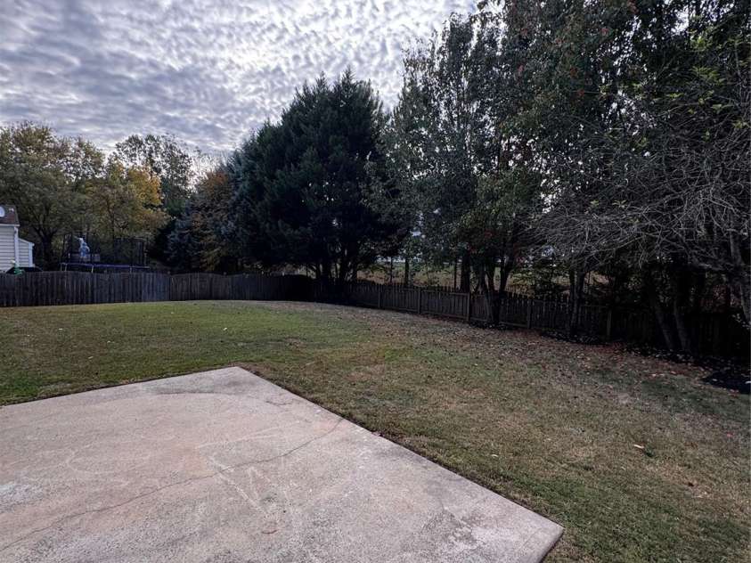 7803 Noland Woods Drive, Charlotte, NC 28277.  MLS# CAR4316221, YatesRealty ID 4335. Flat Backyard