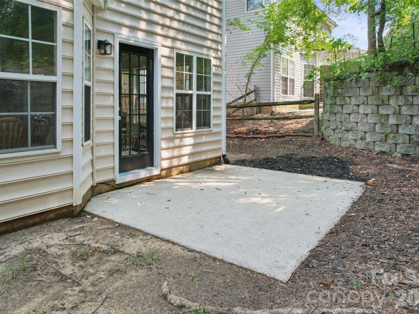 5645 Winslow Avenue, Concord, NC 28027.  MLS# CAR4400484, YatesRealty ID 43352. Back patio