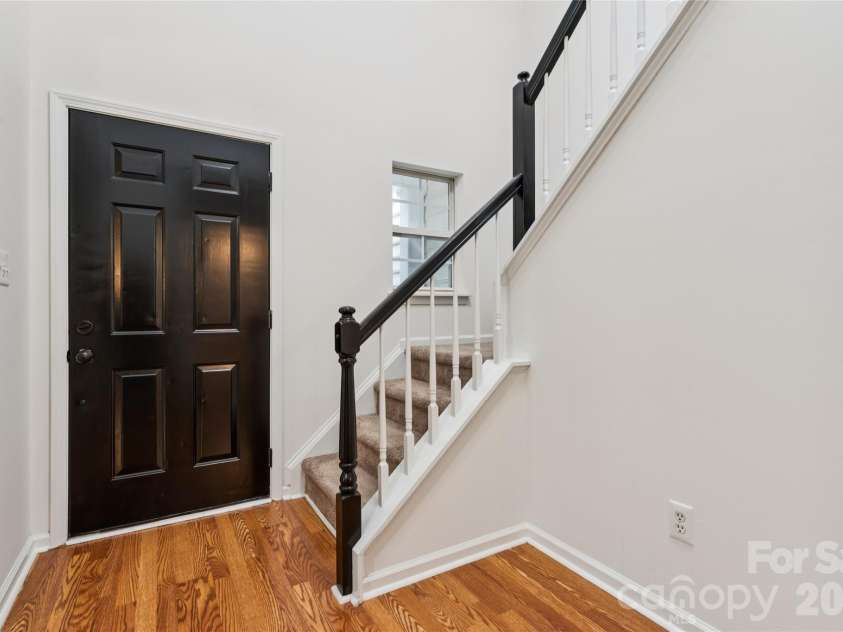 5645 Winslow Avenue, Concord, NC 28027.  MLS# CAR4400484, YatesRealty ID 43352. Front entry leading upstairs