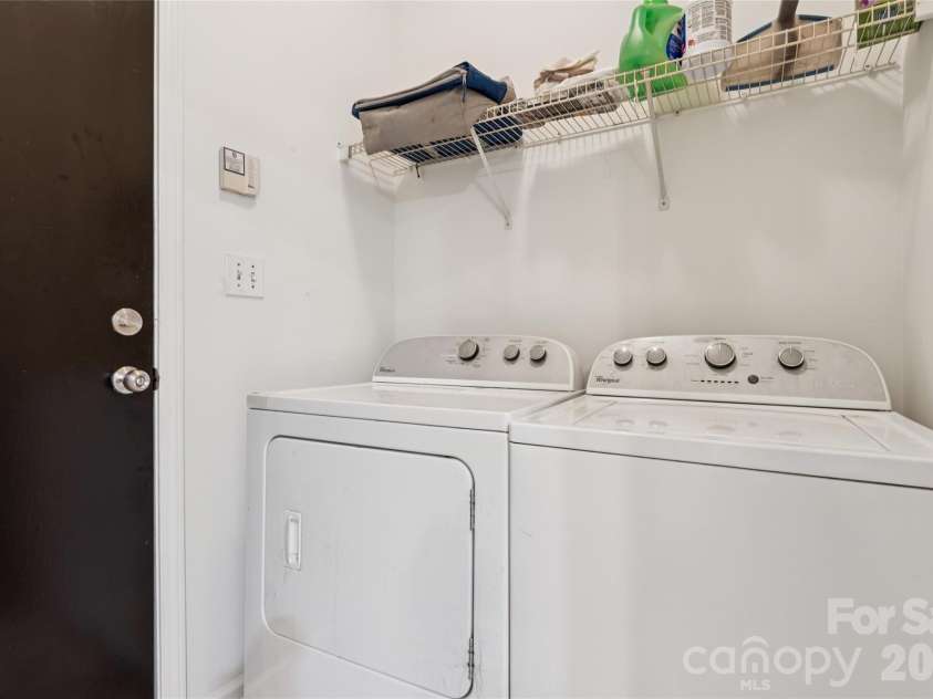 5645 Winslow Avenue, Concord, NC 28027.  MLS# CAR4400484, YatesRealty ID 43352. Laundry room off kitchen leading to garage