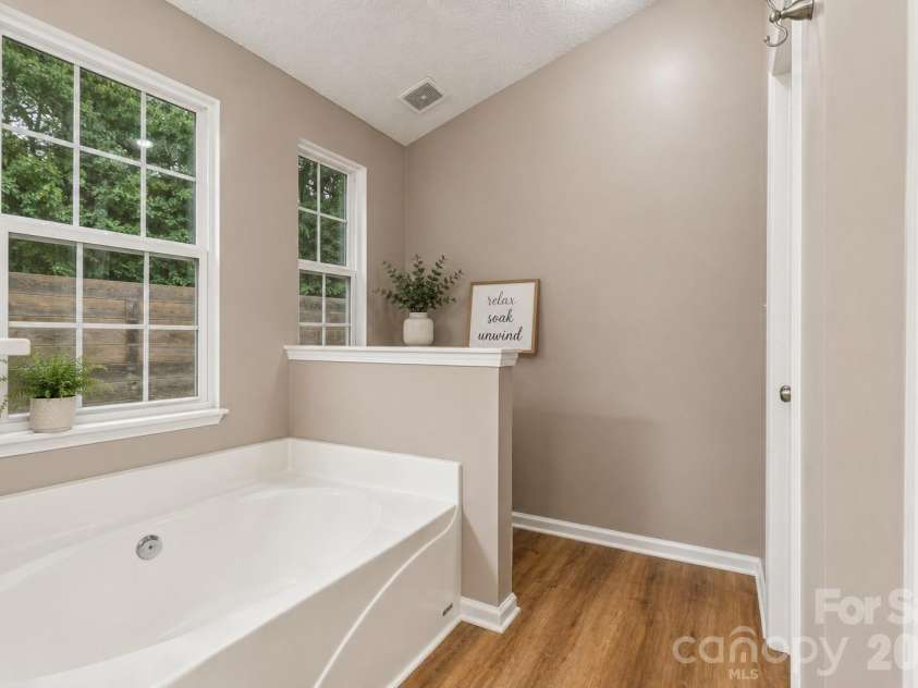 5645 Winslow Avenue, Concord, NC 28027.  MLS# CAR4400484, YatesRealty ID 43352. Primary en suite bathroom with soaking tub