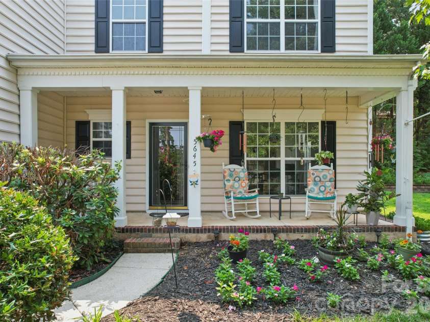 5645 Winslow Avenue, Concord, NC 28027.  MLS# CAR4400484, YatesRealty ID 43352. Rocking chair front porch