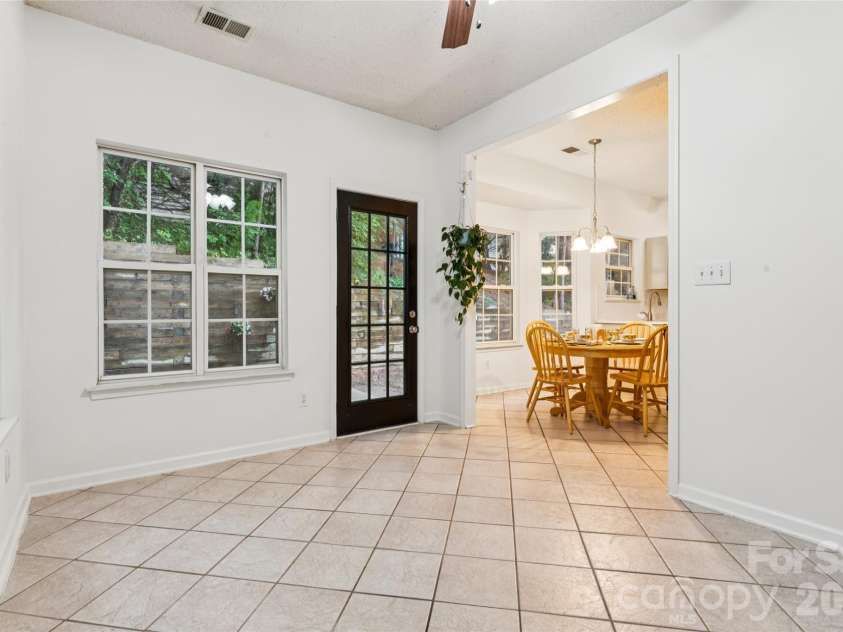 5645 Winslow Avenue, Concord, NC 28027.  MLS# CAR4400484, YatesRealty ID 43352. Sunroom off kitchen