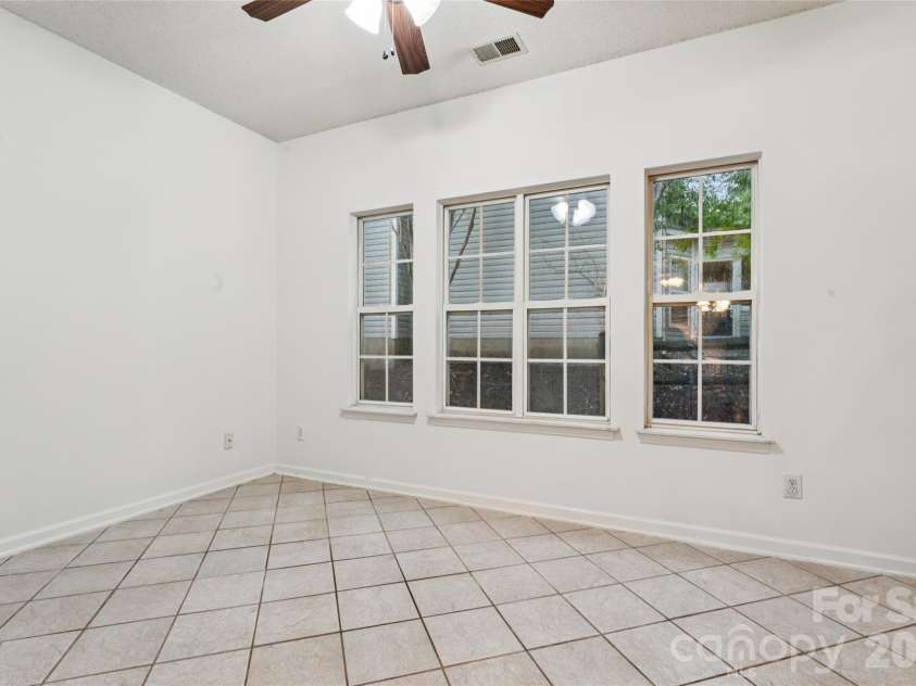 5645 Winslow Avenue, Concord, NC 28027.  MLS# CAR4400484, YatesRealty ID 43352. Sunroom off kitchen
