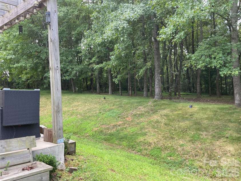 935 Wind Carved Lane, Monroe, NC 28110.  MLS# CAR4412937, YatesRealty ID 43358. Back yard swale