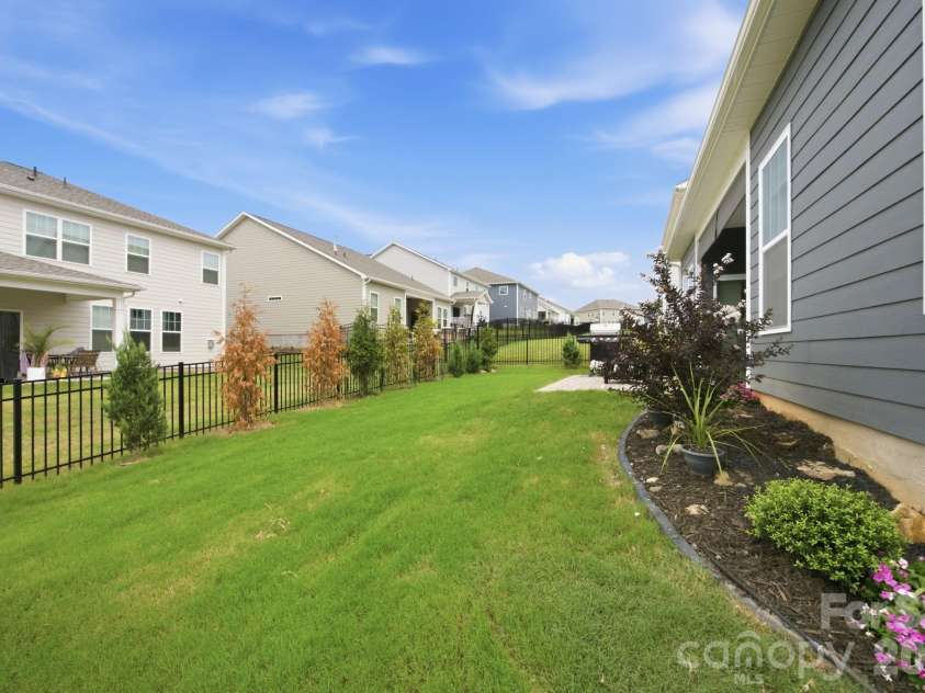 8125 Warford Little Road, Denver, NC 28037.  MLS# CAR4409016, YatesRealty ID 43374. Fenced backyard with privacy trees