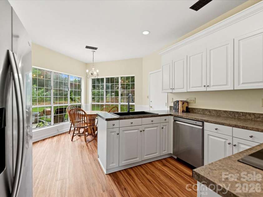 9106 Torrence Crossing Drive, Huntersville, NC 28078.  MLS# CAR4404699, YatesRealty ID 43379. The bright, functional kitchen offers generous cabinet space, ample prep areas, and an open layout perfect for everyday living and entertaining.