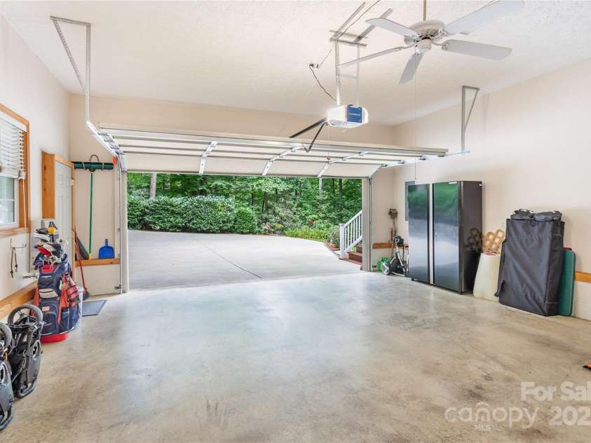 93 Hickory Drive, Maggie Valley, NC 28751.  MLS# CAR4290605, YatesRealty ID 4338. 2 car garage with additional storage