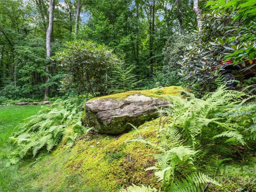 93 Hickory Drive, Maggie Valley, NC 28751.  MLS# CAR4290605, YatesRealty ID 4338. Absolutely beautiful landscaping and natural setting