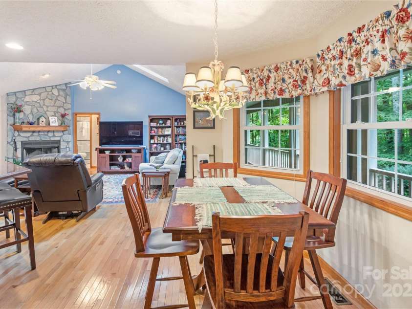 93 Hickory Drive, Maggie Valley, NC 28751.  MLS# CAR4290605, YatesRealty ID 4338. Breakfast nook overlooks park-like backyard