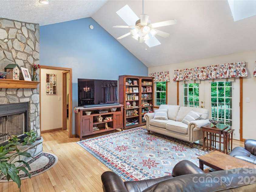 93 Hickory Drive, Maggie Valley, NC 28751.  MLS# CAR4290605, YatesRealty ID 4338. Great room features vaulted ceiling and fireplace