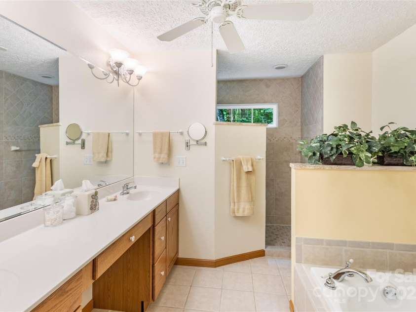 93 Hickory Drive, Maggie Valley, NC 28751.  MLS# CAR4290605, YatesRealty ID 4338. Primary bath also features barrier free walk-in shower