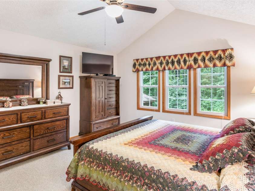 93 Hickory Drive, Maggie Valley, NC 28751.  MLS# CAR4290605, YatesRealty ID 4338. Primary bedroom with private backyard views