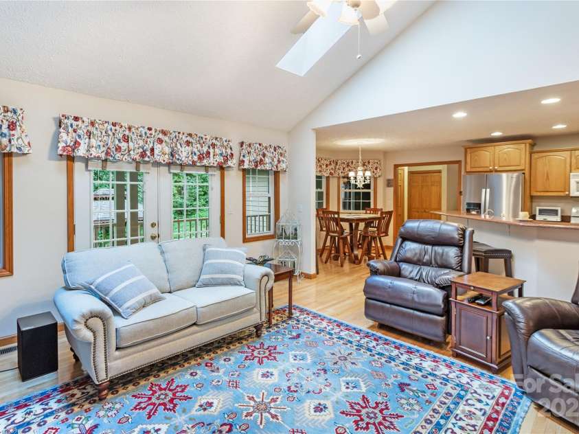 93 Hickory Drive, Maggie Valley, NC 28751.  MLS# CAR4290605, YatesRealty ID 4338. Windows from great room overlook back deck