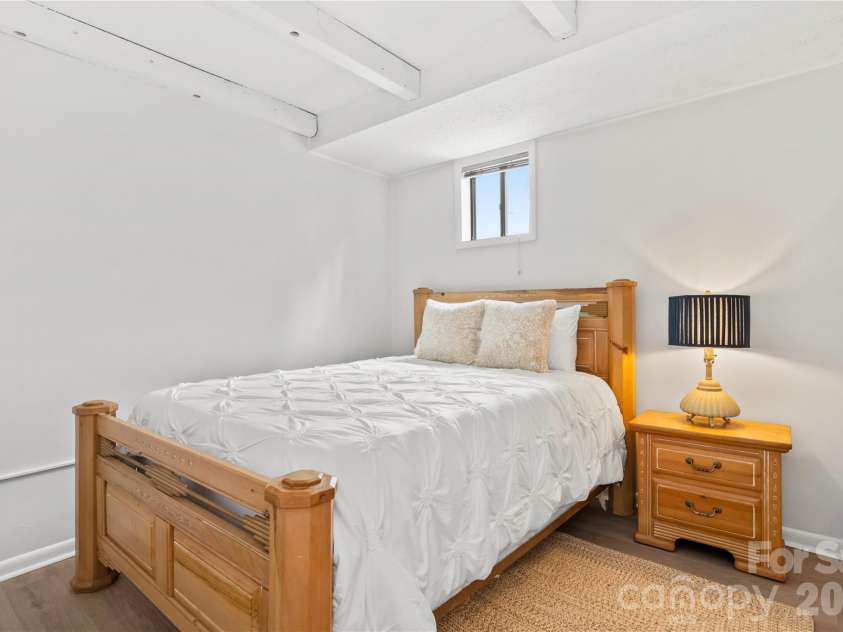 63 Shepard Square, Brevard, NC 28712.  MLS# CAR4411388, YatesRealty ID 43382. Lower Level Bedroom