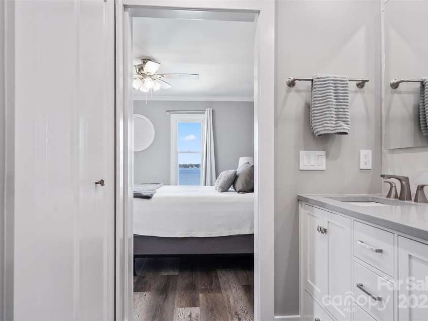 18589 Vineyard Point Lane, Cornelius, NC 28031.  MLS# CAR4305413, YatesRealty ID 4340. Primary bathroom looking into Primary Bedroom