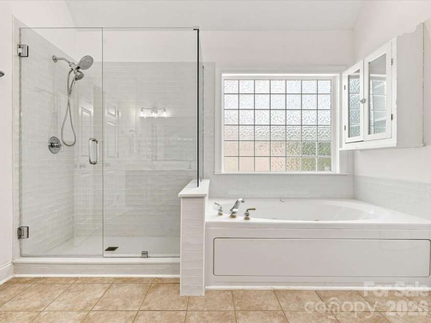 1012 Easthampton Lane, Waxhaw, NC 28173.  MLS# CAR4406705, YatesRealty ID 43403. Updated primary tiled shower and soaking jet tub