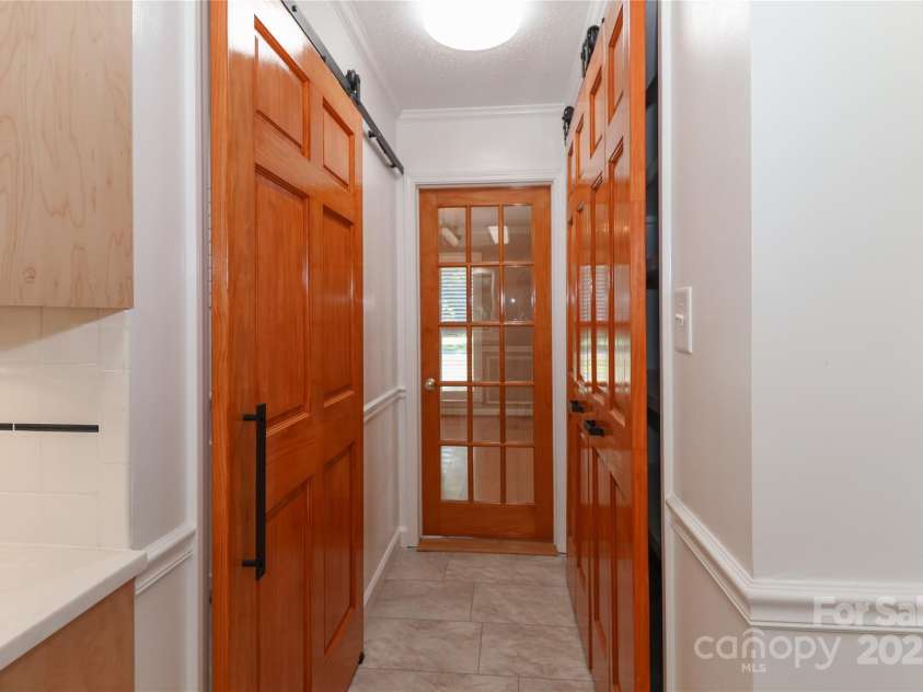1051 Michael Avenue, Concord, NC 28025.  MLS# CAR4304116, YatesRealty ID 4341. Laundry room on left pantry on right