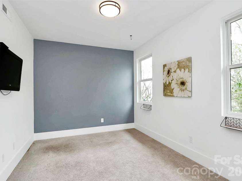 1004 Margaret Brown Street, Charlotte, NC 28202.  MLS# CAR4341341, YatesRealty ID 4342. Second bedroom (mounted TV conveys!)