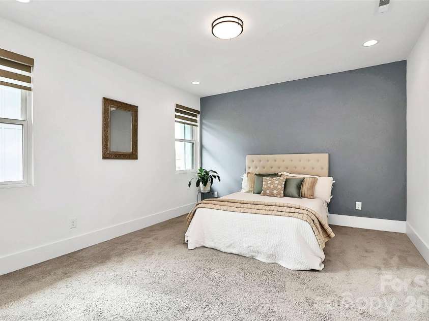 1004 Margaret Brown Street, Charlotte, NC 28202.  MLS# CAR4341341, YatesRealty ID 4342. Spacious primary bedroom w/light filtering or privacy window treatments