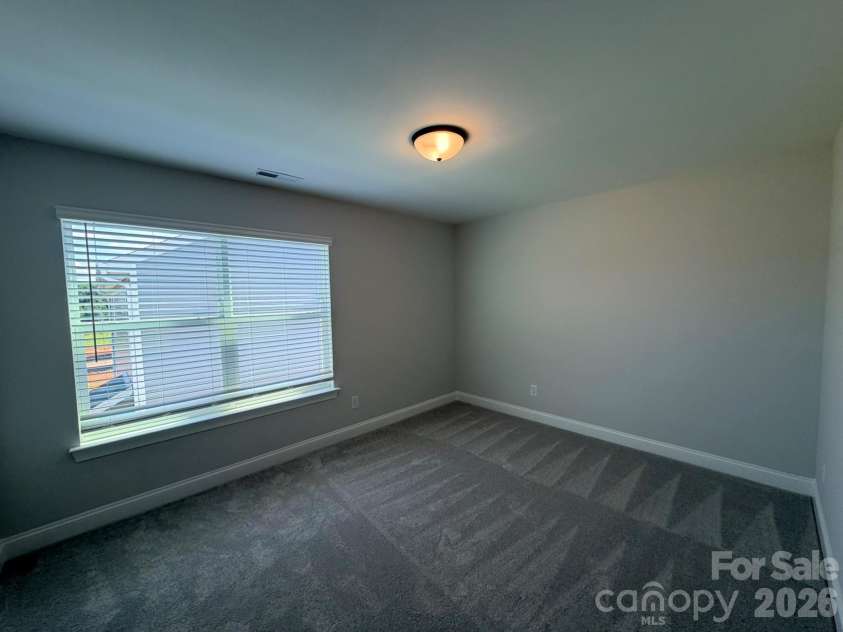 126 Swing Way, Troutman, NC 28166.  MLS# CAR4361197, YatesRealty ID 43426. Upper level bed