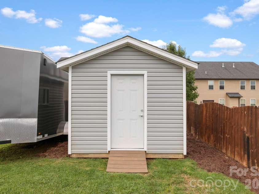 38 Swift Creek Road, Fletcher, NC 28732.  MLS# CAR4413566, YatesRealty ID 43429. Custom shed gives extra storage space