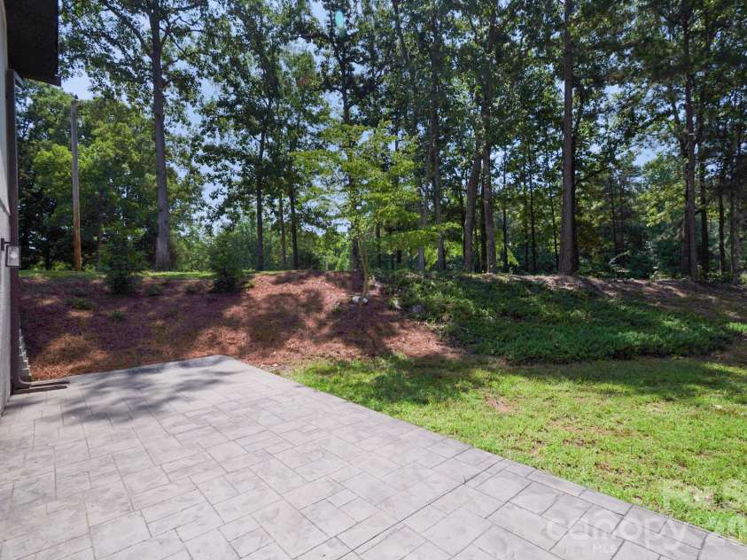 5033 Waxhaw Indian Trail Road, Matthews, NC 28104.  MLS# CAR4398876, YatesRealty ID 43444. Backyard