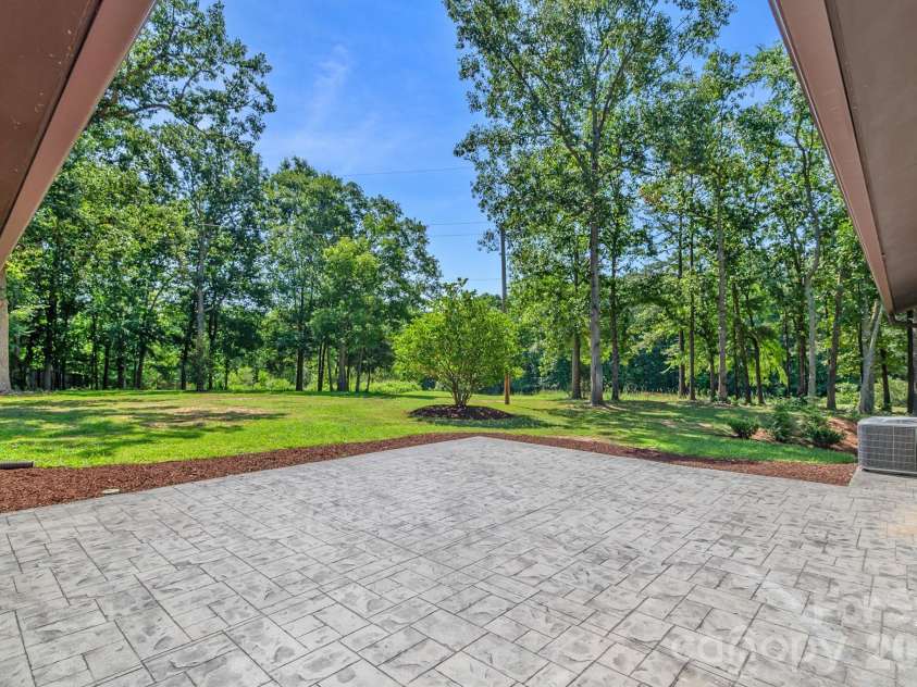 5033 Waxhaw Indian Trail Road, Matthews, NC 28104.  MLS# CAR4398876, YatesRealty ID 43444. Backyard