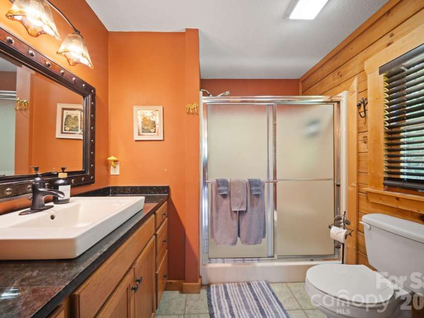 417 Garden Lane, Lake Lure, NC 28746.  MLS# CAR4411192, YatesRealty ID 43446. 